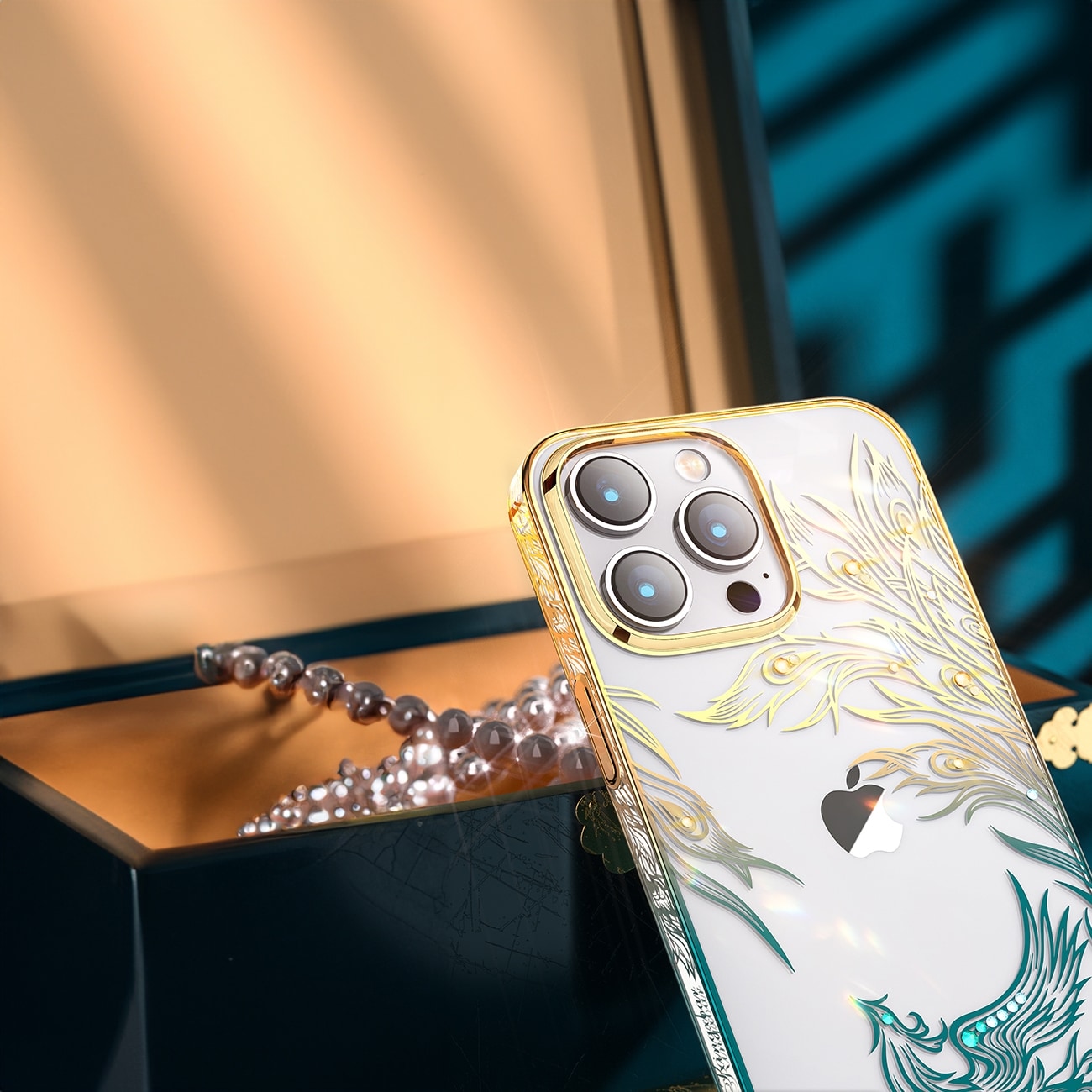 Luksus iPhone 14 Plus-etui med Kingxbar Phoenix-krystaller - gull og blå